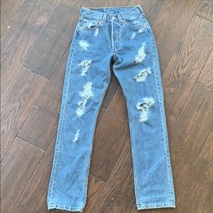 Butt ripped distressed Levi’s jeans